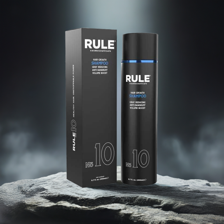 Rule No. 10 Hair Growth Shampoo packaging and bottle, featuring benefits like grey reduction, anti-dandruff, and volume boost, set on a rugged stone surface under a soft spotlight, emphasizing its premium and performance-driven design.