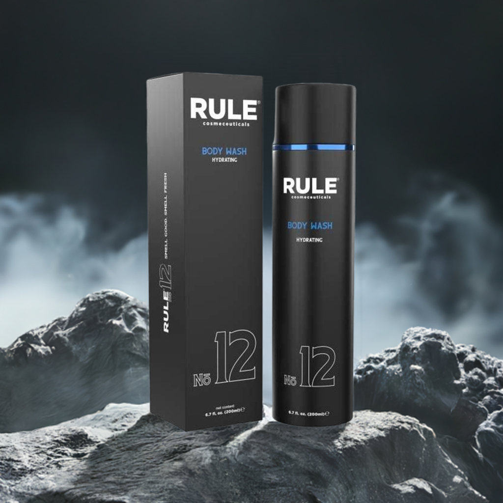 Rule No. 12 Hydrating Body Wash packaging and bottle, emphasizing its moisturizing benefits, set on a rugged terrain with a misty, dramatic background, highlighting its premium and revitalizing qualities.