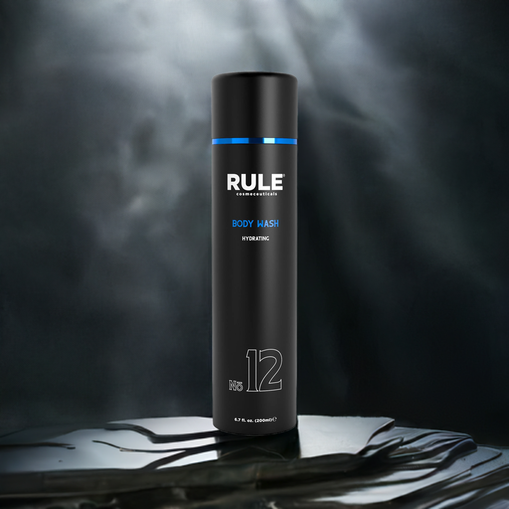 Rule No. 12 Hydrating Body Wash bottle, showcasing its moisturizing benefits, displayed on a sleek surface with a dramatic smoky background, highlighting its modern and premium design.