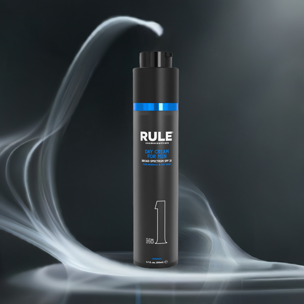 Rule No. 1 All-in-One Day Cream for Men bottle, highlighted with SPF 20 protection, surrounded by dynamic mist effects against a dark background, showcasing its sleek and premium design.