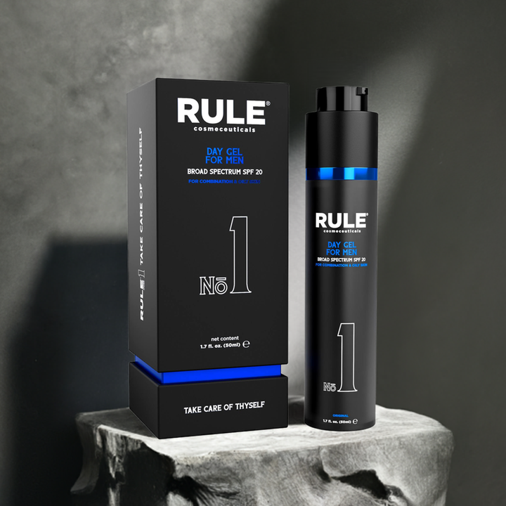 Rule No. 1 Day Gel for Men packaging and bottle, featuring SPF 20 protection for combination and oily skin, displayed on a textured stone pedestal with a soft, elegant shadowed background, highlighting its premium quality.