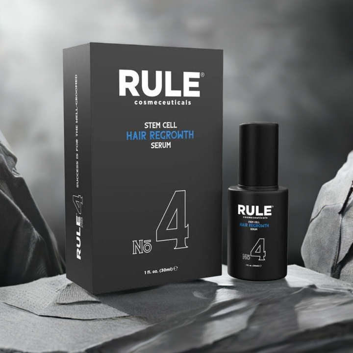 Rule No. 4 Stem Cell Hair Regrowth Serum packaging and bottle, highlighting its advanced hair restoration formula, set against a rugged fabric and stone backdrop, emphasizing its premium and effective qualities.