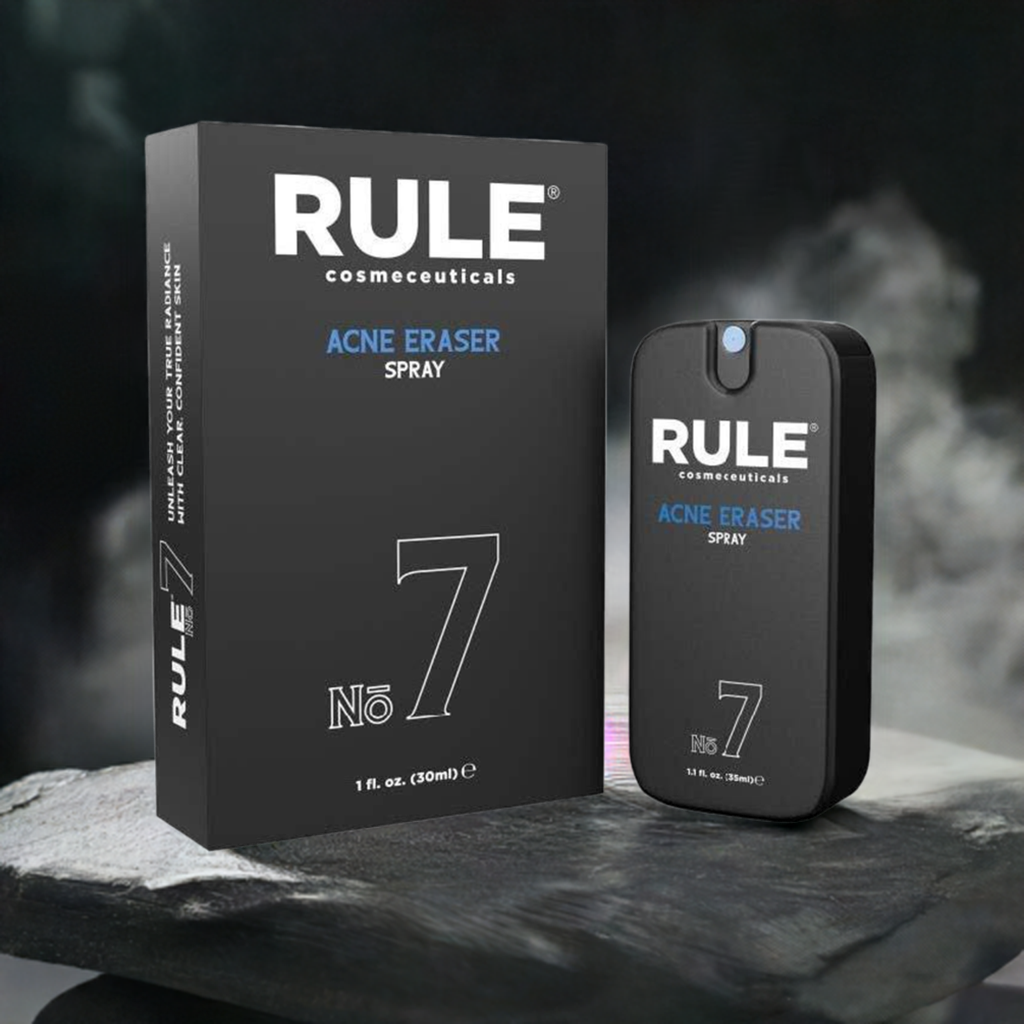 Rule Cosmeceuticals No. 7 Acne Eraser Spray bottle and box showcased on a sleek, dark stone surface with a misty, dramatic background. A powerful solution for clear, confident skin by targeting and preventing acne breakouts.