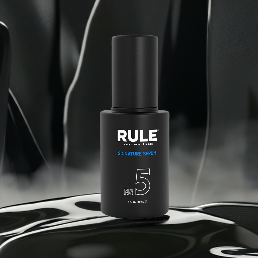 A sleek black bottle of Rule Cosmeceuticals No.5 Signature Serum displayed against a modern, dark background with a smooth, glossy texture.